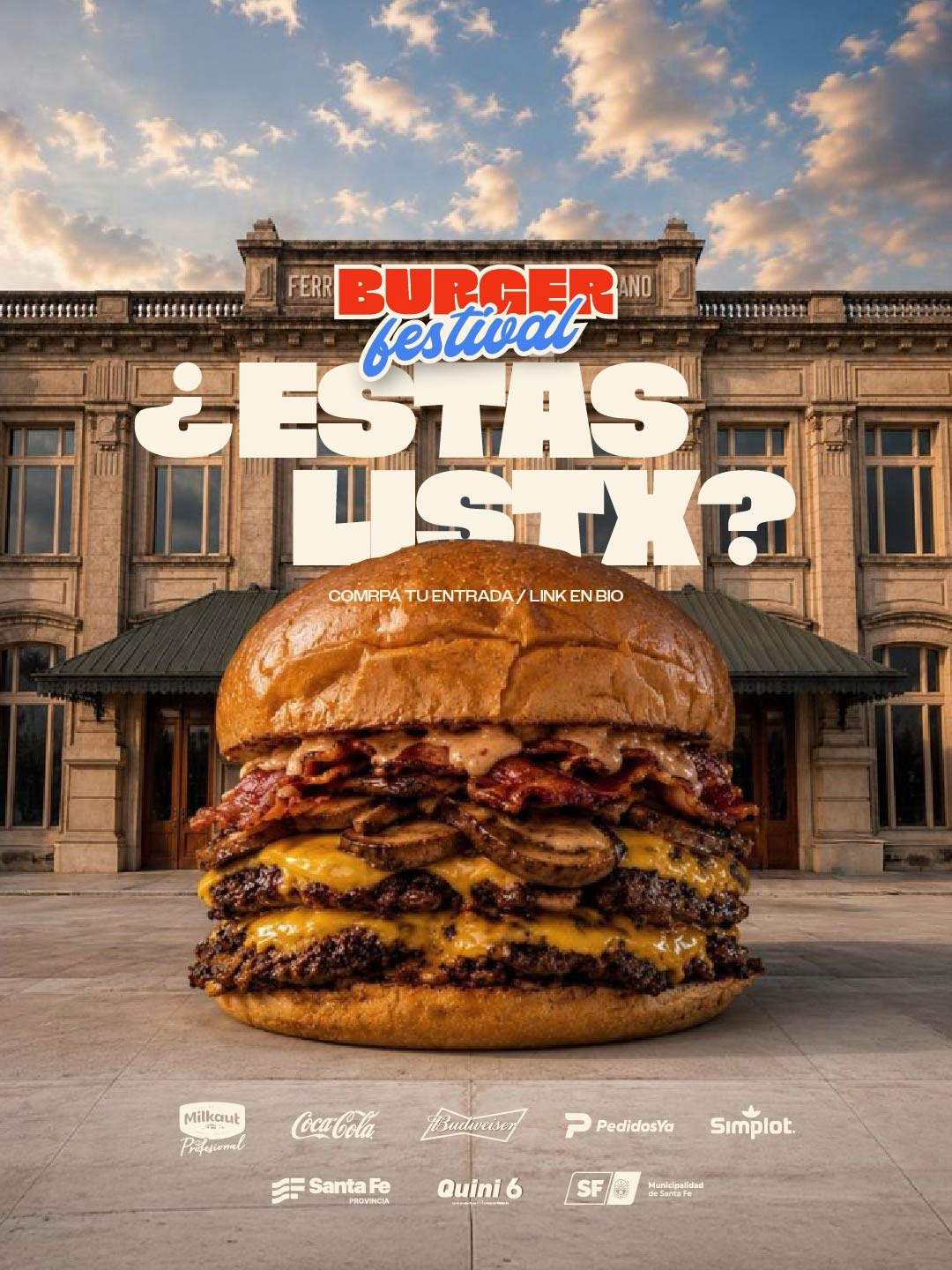 El folleto publicitario del Burger Festival presenta una hamburguesa gigante en primer plano, con dos carnes, queso derretido, panceta y aderezo, armada sobre un pan con semillas.De fondo se observa la fachada histórica de la Estación Belgrano bajo un cielo con nubes iluminadas por el sol. En la parte superior, las letras del evento combinan el nombre "BURGER" en un rectángulo rojo y "festival" en tipografía cursiva azul, acompañadas por la pregunta promocional en letras blancas gigantes "¿ESTÁS LISTO?". En el centro del afiche se lee la indicación "COMPRÁ TU ENTRADA / LINK EN BIO", mientras que la franja inferior reúne los logotipos de los auspiciantes principales.